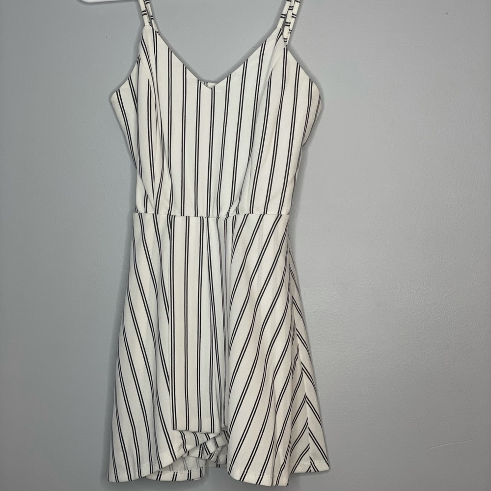 Windsor stripped romper with adjustable straps.